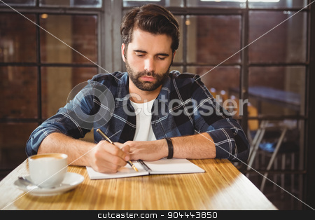 To use this stock image in your creative project, please select the size you need over to the right and click the "Add to Cart" button.
Your downloaded image will come with the Cutcaster watermark removed so don’t worry about the watermark you see on this page. Young man taking notes in his notebook stock photo, Young man taking notes in his notebook at a cafe by Wavebreak Media