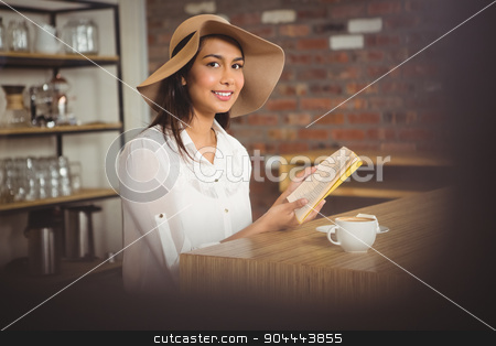 To use this stock image in your creative project, please select the size you need over to the right and click the "Add to Cart" button.
Your downloaded image will come with the Cutcaster watermark removed so don’t worry about the watermark you see on this page. Beautiful businesswoman reading a book stock photo, Beautiful businesswoman reading a book outside at the coffee shop by Wavebreak Media