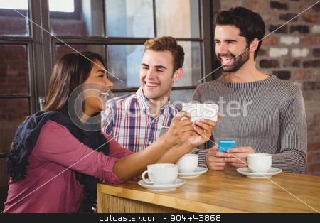 To use this stock image in your creative project, please select the size you need over to the right and click the "Add to Cart" button.
Your downloaded image will come with the Cutcaster watermark removed so don’t worry about the watermark you see on this page. Group of friends looking at a smartphone stock photo, Group of friends looking at a smartphone in a cafe by Wavebreak Media