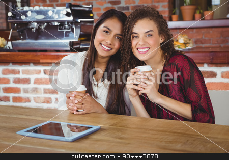 To use this stock image in your creative project, please select the size you need over to the right and click the "Add to Cart" button.
Your downloaded image will come with the Cutcaster watermark removed so don’t worry about the watermark you see on this page. Pretty female friends enjoying a coffee using tablet pc stock photo, Pretty female friends enjoying a coffee using tablet pc at the coffee shop by Wavebreak Media