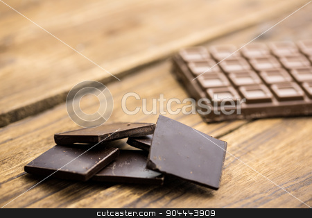 To use this stock image in your creative project, please select the size you need over to the right and click the "Add to Cart" button.
Your downloaded image will come with the Cutcaster watermark removed so don’t worry about the watermark you see on this page. Pieces of chocolate on a wooden table stock photo, Close up view of pieces of chocolate on a wooden table by Wavebreak Media
