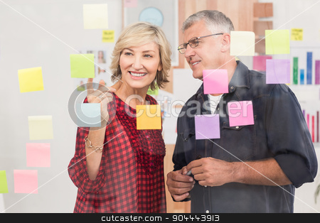 To use this stock image in your creative project, please select the size you need over to the right and click the "Add to Cart" button.
Your downloaded image will come with the Cutcaster watermark removed so don’t worry about the watermark you see on this page. Business team pointing post its on the wall stock photo, Business team pointing post its on the wall at office by Wavebreak Media