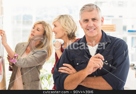 To use this stock image in your creative project, please select the size you need over to the right and click the "Add to Cart" button.
Your downloaded image will come with the Cutcaster watermark removed so don’t worry about the watermark you see on this page. Businessman with arms crossed with his team behind stock photo, Businessman with arms crossed with his team behind at office by Wavebreak Media