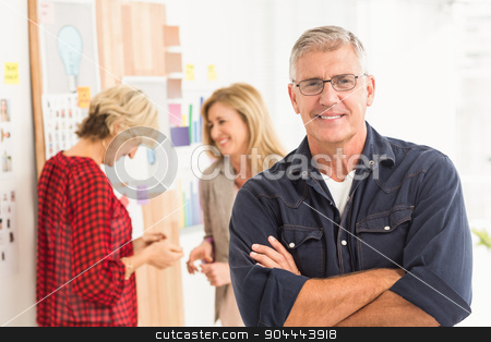 To use this stock image in your creative project, please select the size you need over to the right and click the "Add to Cart" button.
Your downloaded image will come with the Cutcaster watermark removed so don’t worry about the watermark you see on this page. Businessman with arms crossed with his team behind stock photo, Businessman with arms crossed with his team behind at office by Wavebreak Media