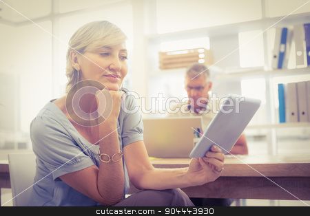 To use this stock image in your creative project, please select the size you need over to the right and click the "Add to Cart" button.
Your downloaded image will come with the Cutcaster watermark removed so don’t worry about the watermark you see on this page. Smiling businesswoman looking at her tablet stock photo, Smiling businesswoman looking at her tablet at office by Wavebreak Media