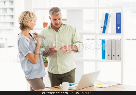 To use this stock image in your creative project, please select the size you need over to the right and click the "Add to Cart" button.
Your downloaded image will come with the Cutcaster watermark removed so don’t worry about the watermark you see on this page. Attentive business team discussing over a laptop stock photo, Attentive business team discussing over a laptop at office by Wavebreak Media