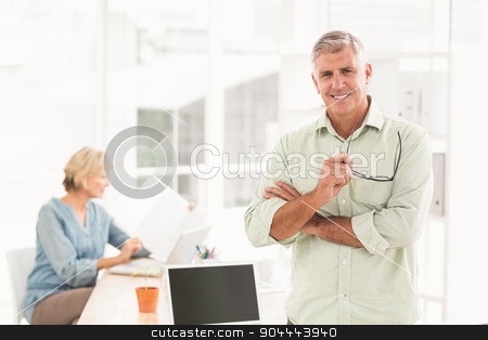 To use this stock image in your creative project, please select the size you need over to the right and click the "Add to Cart" button.
Your downloaded image will come with the Cutcaster watermark removed so don’t worry about the watermark you see on this page. Standing smiling businessman looking at the camera stock photo, Portrait of a standing businessman with arms crossed at the office by Wavebreak Media