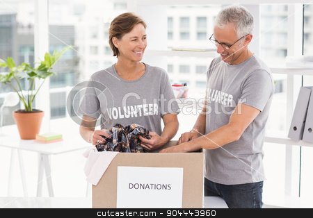To use this stock image in your creative project, please select the size you need over to the right and click the "Add to Cart" button.
Your downloaded image will come with the Cutcaster watermark removed so don’t worry about the watermark you see on this page. Smiling volunteers sorting donation box stock photo, Smiling volunteers sorting donation box in the office by Wavebreak Media