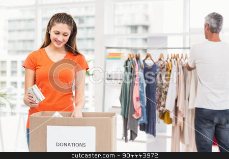 To use this stock image in your creative project, please select the size you need over to the right and click the "Add to Cart" button.
Your downloaded image will come with the Cutcaster watermark removed so don’t worry about the watermark you see on this page. Casual business colleagues sorting donations stock photo, Casual business colleagues sorting donations in the office by Wavebreak Media