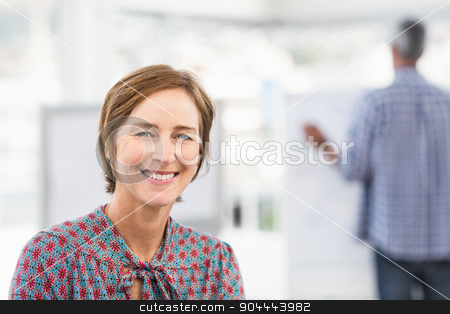 To use this stock image in your creative project, please select the size you need over to the right and click the "Add to Cart" button.
Your downloaded image will come with the Cutcaster watermark removed so don’t worry about the watermark you see on this page. Smiling casual businesswoman in front of colleague stock photo, Smiling casual businesswoman in front of colleague in the office by Wavebreak Media