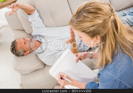 To use this stock image in your creative project, please select the size you need over to the right and click the "Add to Cart" button.
Your downloaded image will come with the Cutcaster watermark removed so don’t worry about the watermark you see on this page. Depressed man lying on couch and talking to therapist stock photo, Depressed man lying on couch and talking to therapist in the office by Wavebreak Media