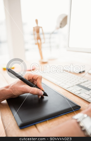To use this stock image in your creative project, please select the size you need over to the right and click the "Add to Cart" button.
Your downloaded image will come with the Cutcaster watermark removed so don’t worry about the watermark you see on this page. Close up view of hands using digtizer and computer stock photo, Close up view of hands using digtizer and computer in the office by Wavebreak Media