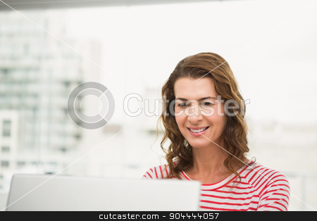 To use this stock image in your creative project, please select the size you need over to the right and click the "Add to Cart" button.
Your downloaded image will come with the Cutcaster watermark removed so don’t worry about the watermark you see on this page. Smiling casual businesswoman using laptop stock photo, Smiling casual businesswoman using laptop in the office by Wavebreak Media