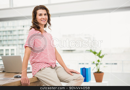 To use this stock image in your creative project, please select the size you need over to the right and click the "Add to Cart" button.
Your downloaded image will come with the Cutcaster watermark removed so don’t worry about the watermark you see on this page. Smiling casual businesswoman leaning on desk stock photo, Portrait of smiling casual businesswoman leaning on desk in the office by Wavebreak Media