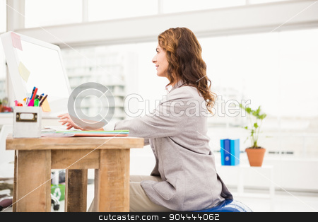 To use this stock image in your creative project, please select the size you need over to the right and click the "Add to Cart" button.
Your downloaded image will come with the Cutcaster watermark removed so don’t worry about the watermark you see on this page. Casual businesswoman sitting on exercise ball while working stock photo, Casual businesswoman sitting on exercise ball while working in the office by Wavebreak Media
