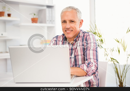 To use this stock image in your creative project, please select the size you need over to the right and click the "Add to Cart" button.
Your downloaded image will come with the Cutcaster watermark removed so don’t worry about the watermark you see on this page. Smiling casual businessman working with computer stock photo, Portrait of smiling casual businessman working with computer in the office by Wavebreak Media