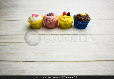 To use this stock image in your creative project, please select the size you need over to the right and click the "Add to Cart" button.
Your downloaded image will come with the Cutcaster watermark removed so don’t worry about the watermark you see on this page. Delicious cupcakes on a table stock photo, Delicious cupcakes on a table shot in studio by Wavebreak Media