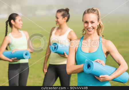 To use this stock image in your creative project, please select the size you need over to the right and click the "Add to Cart" button.
Your downloaded image will come with the Cutcaster watermark removed so don’t worry about the watermark you see on this page. Smiling sporty blonde in front of friends stock photo, Portrait of smiling sporty blonde in front of friends in parkland by Wavebreak Media