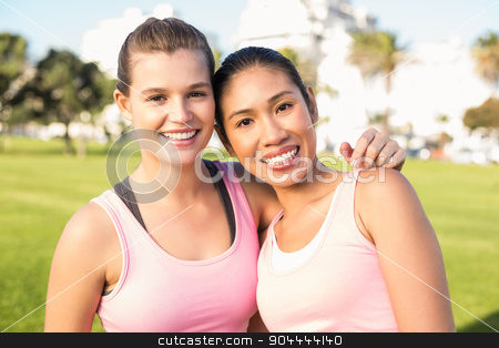 To use this stock image in your creative project, please select the size you need over to the right and click the "Add to Cart" button.
Your downloaded image will come with the Cutcaster watermark removed so don’t worry about the watermark you see on this page. Two smiling women wearing pink for breast cancer stock photo, Portrait of two smiling women wearing pink for breast cancer in parkland by Wavebreak Media