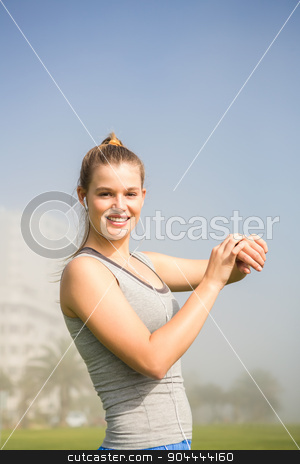 To use this stock image in your creative project, please select the size you need over to the right and click the "Add to Cart" button.
Your downloaded image will come with the Cutcaster watermark removed so don’t worry about the watermark you see on this page. Smiling sporty blonde using smart watch stock photo, Portrait of smiling sporty blonde using smart watch in parkland by Wavebreak Media