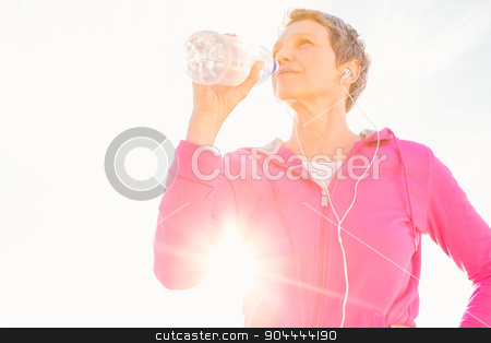 To use this stock image in your creative project, please select the size you need over to the right and click the "Add to Cart" button.
Your downloaded image will come with the Cutcaster watermark removed so don’t worry about the watermark you see on this page. Sporty woman with headphones drinking water stock photo, Sporty woman with headphones drinking water at promenade by Wavebreak Media