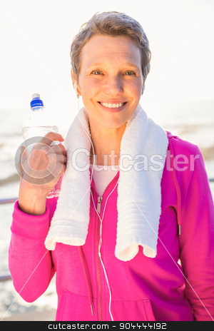 To use this stock image in your creative project, please select the size you need over to the right and click the "Add to Cart" button.
Your downloaded image will come with the Cutcaster watermark removed so don’t worry about the watermark you see on this page. Smiling sporty woman with water bottle listening to music stock photo, Portrait of smiling sporty woman with water bottle listening to music at promenade by Wavebreak Media