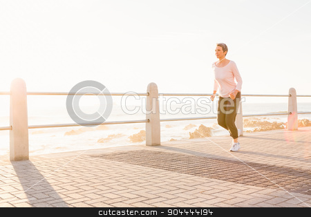 To use this stock image in your creative project, please select the size you need over to the right and click the "Add to Cart" button.
Your downloaded image will come with the Cutcaster watermark removed so don’t worry about the watermark you see on this page. Sporty woman jogging at promenade stock photo, Sporty woman jogging at promenade on a sunny day by Wavebreak Media