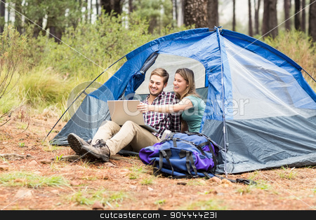 To use this stock image in your creative project, please select the size you need over to the right and click the "Add to Cart" button.
Your downloaded image will come with the Cutcaster watermark removed so don’t worry about the watermark you see on this page. Young pretty hiker couple sitting in a tent looking at laptop stock photo, Young pretty hiker couple sitting in a tent looking at laptop in the nature by Wavebreak Media
