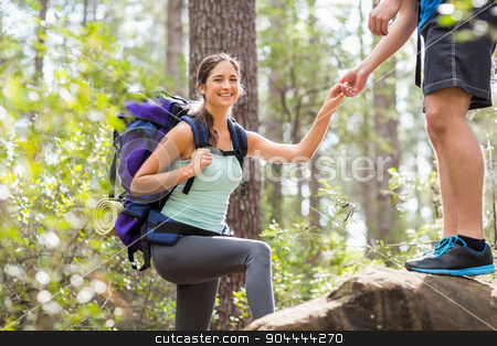 To use this stock image in your creative project, please select the size you need over to the right and click the "Add to Cart" button.
Your downloaded image will come with the Cutcaster watermark removed so don’t worry about the watermark you see on this page. Happy hikers climbing on rock and smiling at camera stock photo, Happy hikers climbing on rock and smiling at camera in the nature by Wavebreak Media