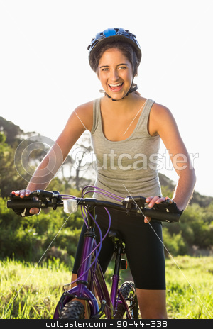 To use this stock image in your creative project, please select the size you need over to the right and click the "Add to Cart" button.
Your downloaded image will come with the Cutcaster watermark removed so don’t worry about the watermark you see on this page. Smiling athletic brunette sitting on mountain bike stock photo, Portrait of smiling athletic brunette sitting on mountain bike in the nature by Wavebreak Media