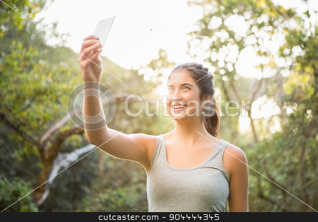 To use this stock image in your creative project, please select the size you need over to the right and click the "Add to Cart" button.
Your downloaded image will come with the Cutcaster watermark removed so don’t worry about the watermark you see on this page. Smiling athletic brunette taking selfies stock photo, Smiling athletic brunette taking selfies in the nature by Wavebreak Media