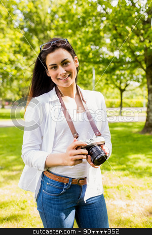 To use this stock image in your creative project, please select the size you need over to the right and click the "Add to Cart" button.
Your downloaded image will come with the Cutcaster watermark removed so don’t worry about the watermark you see on this page. Beautiful brunette taking photo in the park stock photo, Beautiful brunette taking photo in the park on a sunny day by Wavebreak Media