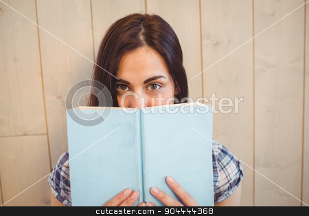 To use this stock image in your creative project, please select the size you need over to the right and click the "Add to Cart" button.
Your downloaded image will come with the Cutcaster watermark removed so don’t worry about the watermark you see on this page. Pretty hipster reading blue book stock photo, Pretty hipster reading blue book on wooden planks background by Wavebreak Media