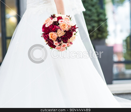 To use this stock image in your creative project, please select the size you need over to the right and click the "Add to Cart" button.
Your downloaded image will come with the Cutcaster watermark removed so don’t worry about the watermark you see on this page. wedding bouquet in hands of the bride stock photo, Beautiful wedding bouquet in hands of the bride by Satura86
