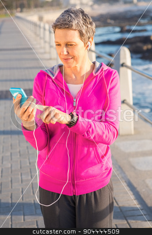 To use this stock image in your creative project, please select the size you need over to the right and click the "Add to Cart" button.
Your downloaded image will come with the Cutcaster watermark removed so don’t worry about the watermark you see on this page. Smiling sporty woman enjoying music and holding phone stock photo, Smiling sporty woman enjoying music and holding phone at promenade by Wavebreak Media