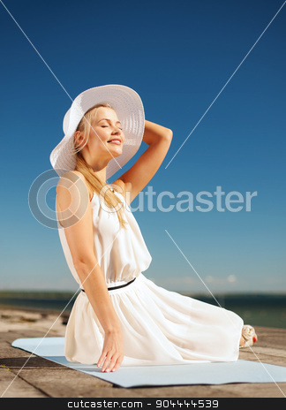 To use this stock image in your creative project, please select the size you need over to the right and click the "Add to Cart" button.
Your downloaded image will come with the Cutcaster watermark removed so don’t worry about the watermark you see on this page. beautiful woman enjoying summer outdoors stock photo, fashion and lifestyle concept - beautiful woman in hat enjoying summer outdoors by Syda Productions