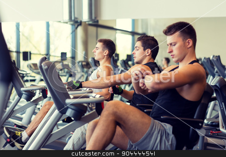 To use this stock image in your creative project, please select the size you need over to the right and click the "Add to Cart" button.
Your downloaded image will come with the Cutcaster watermark removed so don’t worry about the watermark you see on this page. men working out on exercise bike in gym stock photo, sport, fitness, lifestyle, technology and people concept - men working out on exercise bike in gym by Syda Productions
