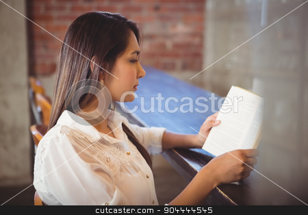 To use this stock image in your creative project, please select the size you need over to the right and click the "Add to Cart" button.
Your downloaded image will come with the Cutcaster watermark removed so don’t worry about the watermark you see on this page. Beautiful businesswoman reading a book stock photo, Beautiful businesswoman reading a book outside at the coffee shop by Wavebreak Media