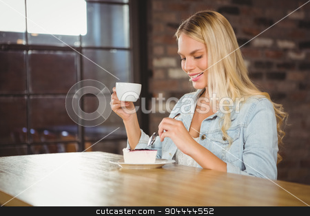 To use this stock image in your creative project, please select the size you need over to the right and click the "Add to Cart" button.
Your downloaded image will come with the Cutcaster watermark removed so don’t worry about the watermark you see on this page. Smiling blonde enjoying cake and coffee stock photo, Smiling blonde enjoying cake and coffee at coffee shop by Wavebreak Media
