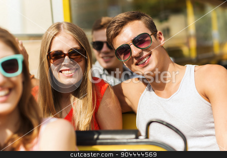 To use this stock image in your creative project, please select the size you need over to the right and click the "Add to Cart" button.
Your downloaded image will come with the Cutcaster watermark removed so don’t worry about the watermark you see on this page. group of smiling friends traveling by tour bus stock photo, friendship, travel, vacation, summer and people concept - group of smiling teenage friends and couple in sunglasses traveling by tour bus by Syda Productions