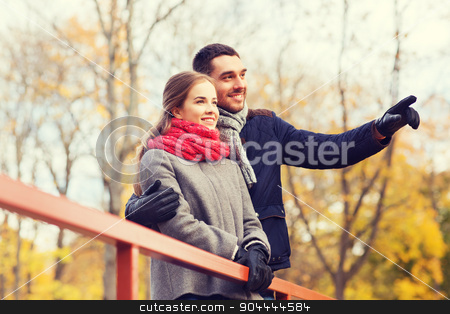 To use this stock image in your creative project, please select the size you need over to the right and click the "Add to Cart" button.
Your downloaded image will come with the Cutcaster watermark removed so don’t worry about the watermark you see on this page. smiling couple hugging on bridge in autumn park stock photo, love, gesture, family, season and people concept - smiling couple hugging on bridge in autumn park by Syda Productions