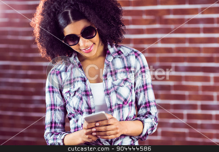 To use this stock image in your creative project, please select the size you need over to the right and click the "Add to Cart" button.
Your downloaded image will come with the Cutcaster watermark removed so don’t worry about the watermark you see on this page. Attractive hipster with sunglasses texting stock photo, Attractive hipster with sunglasses texting against red brick background by Wavebreak Media