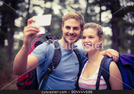 To use this stock image in your creative project, please select the size you need over to the right and click the "Add to Cart" button.
Your downloaded image will come with the Cutcaster watermark removed so don’t worry about the watermark you see on this page. Young happy hikers taking a selfie stock photo, Young happy hikers taking a selfie in the nature by Wavebreak Media