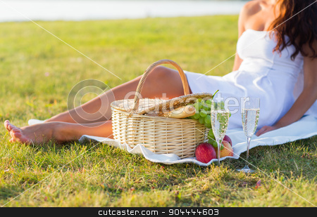 To use this stock image in your creative project, please select the size you need over to the right and click the "Add to Cart" button.
Your downloaded image will come with the Cutcaster watermark removed so don’t worry about the watermark you see on this page. close up of woman with food basket and champagne stock photo, people, summer and holidays concept - close up of woman with food basket and champagne glasses on picnic by Syda Productions