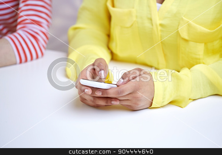 To use this stock image in your creative project, please select the size you need over to the right and click the "Add to Cart" button.
Your downloaded image will come with the Cutcaster watermark removed so don’t worry about the watermark you see on this page. close up of female hands with smartphone stock photo, people, technology and internet concept - close up of african american teenage girl hands with smartphone by Syda Productions
