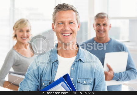 To use this stock image in your creative project, please select the size you need over to the right and click the "Add to Cart" button.
Your downloaded image will come with the Cutcaster watermark removed so don’t worry about the watermark you see on this page. Smiling business colleagues holding workbooks stock photo, Portrait of smiling business colleagues holding workbooks at office by Wavebreak Media