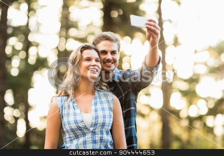 To use this stock image in your creative project, please select the size you need over to the right and click the "Add to Cart" button.
Your downloaded image will come with the Cutcaster watermark removed so don’t worry about the watermark you see on this page. Happy smiling couple embracing and taking selfies stock photo, Happy smiling couple embracing and taking selfies in the nature by Wavebreak Media