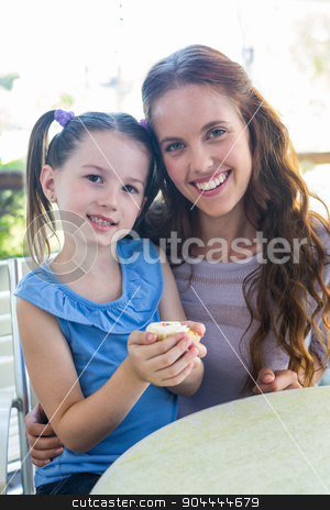 To use this stock image in your creative project, please select the size you need over to the right and click the "Add to Cart" button.
Your downloaded image will come with the Cutcaster watermark removed so don’t worry about the watermark you see on this page. Mother and daughter enjoying cakes at cafe terrace stock photo, Mother and daughter enjoying cakes at cafe terrace on a sunny day by Wavebreak Media