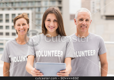 To use this stock image in your creative project, please select the size you need over to the right and click the "Add to Cart" button.
Your downloaded image will come with the Cutcaster watermark removed so don’t worry about the watermark you see on this page. Smiling volunteers with tablet stock photo, Portrait of smiling volunteers with tablet on roof of building by Wavebreak Media