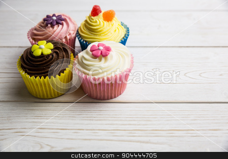 To use this stock image in your creative project, please select the size you need over to the right and click the "Add to Cart" button.
Your downloaded image will come with the Cutcaster watermark removed so don’t worry about the watermark you see on this page. Delicious cupcakes on a table stock photo, Delicious cupcakes on a table shot in studio by Wavebreak Media